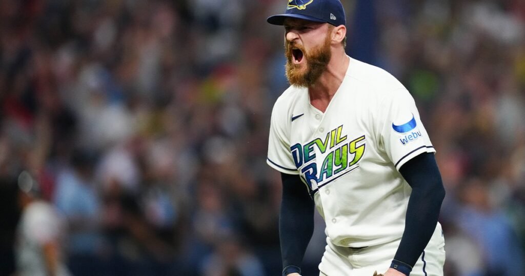 Rays pitcher Bryan Baker reacts after the final out of ALCS Game 2.