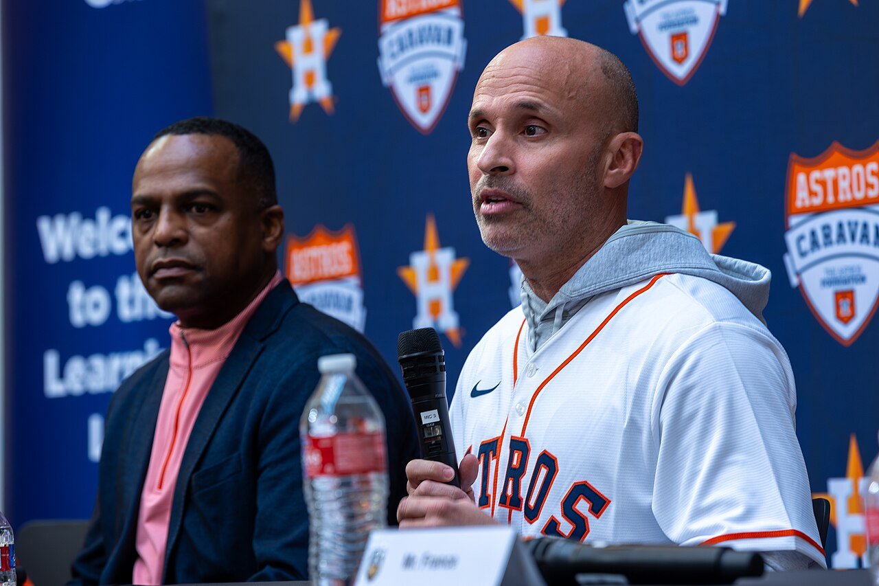 Joe Espada speaks while seated beside Dana Brown at an Astros Caravan event
