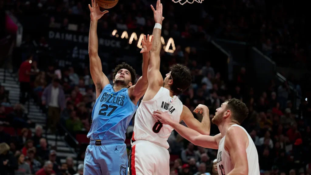 Cameron Boozer shoots over Portland’s Deni Avdija