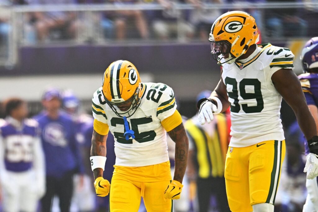 Packers cornerback Keisean Nixon, number 25, beside Barryn Sorrell during a game at Minnesota.