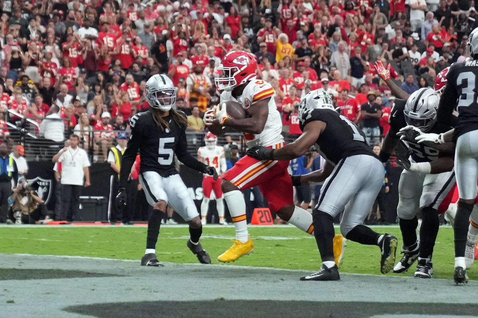Chiefs running back Kenneth Walker III carrying the ball against the Las Vegas Raiders.