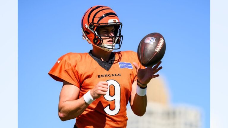 Joe Burrow holds a football during Bengals practice on October 8