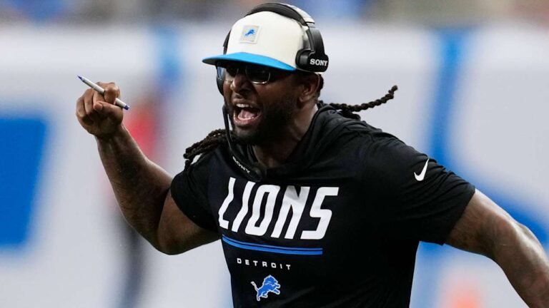 Lions defensive coordinator Kelvin Sheppard wearing a headset on the sideline