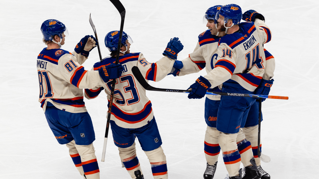 Oilers players celebrate a goal against San Jose.