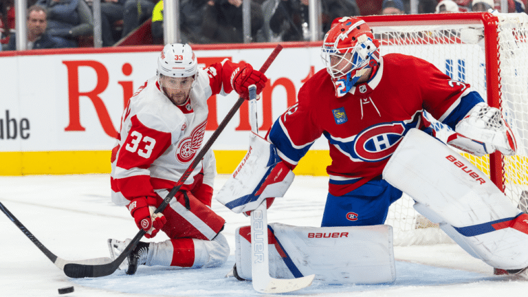 Jacob Fowler defends the Montreal net against a Detroit forward.