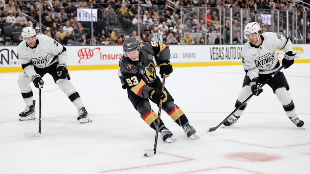 Mitch Marner carries the puck between Los Angeles defenders.