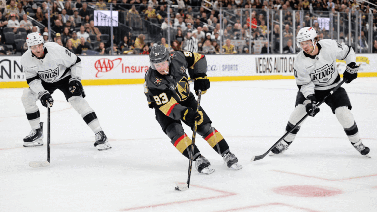 Mitch Marner carries the puck between Los Angeles defenders.