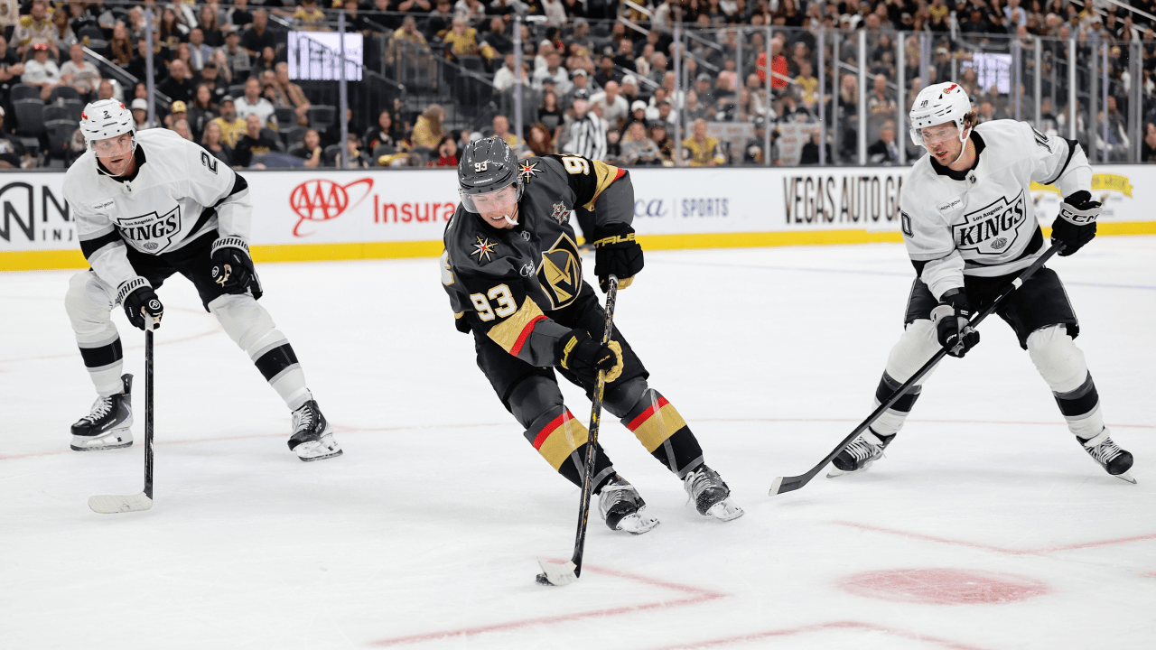 Mitch Marner carries the puck between Los Angeles defenders.