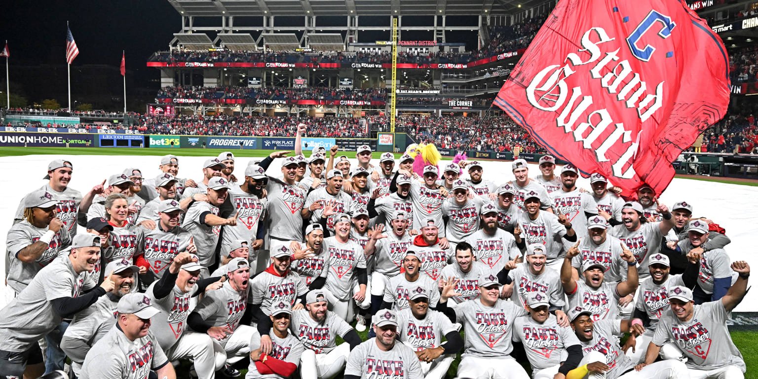Cleveland Guardians players celebrate their ALDS victory.