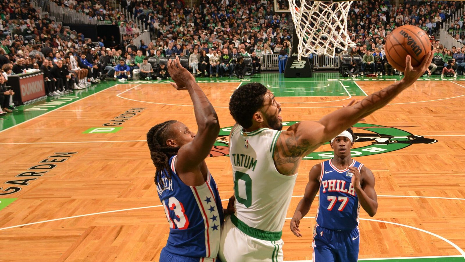 Jayson Tatum attempts a layup against Philadelphia.