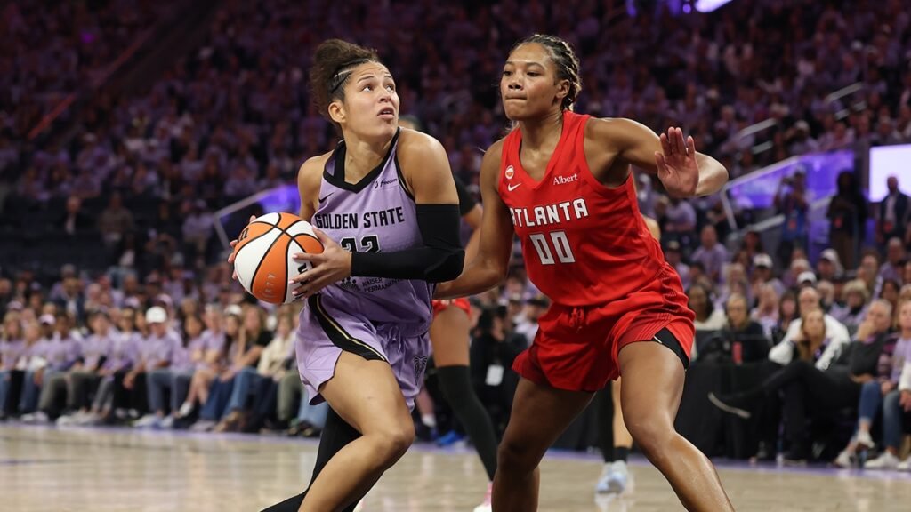 A Golden State Valkyries player controls the ball while guarded by an Atlanta Dream player at Chase Center