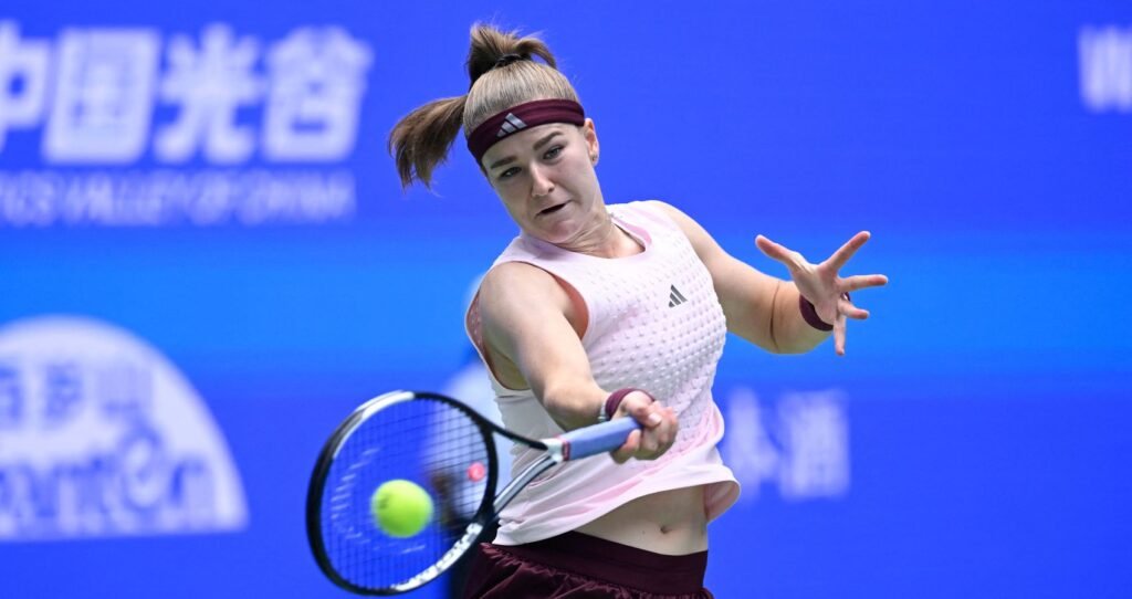 Karolina Muchova reaches forward to play a shot at the 2026 Wuhan Open