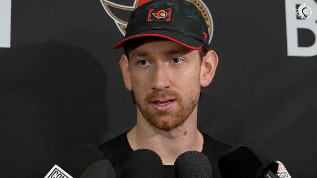 Jake Sanderson speaks with reporters during Ottawa’s pregame availability.