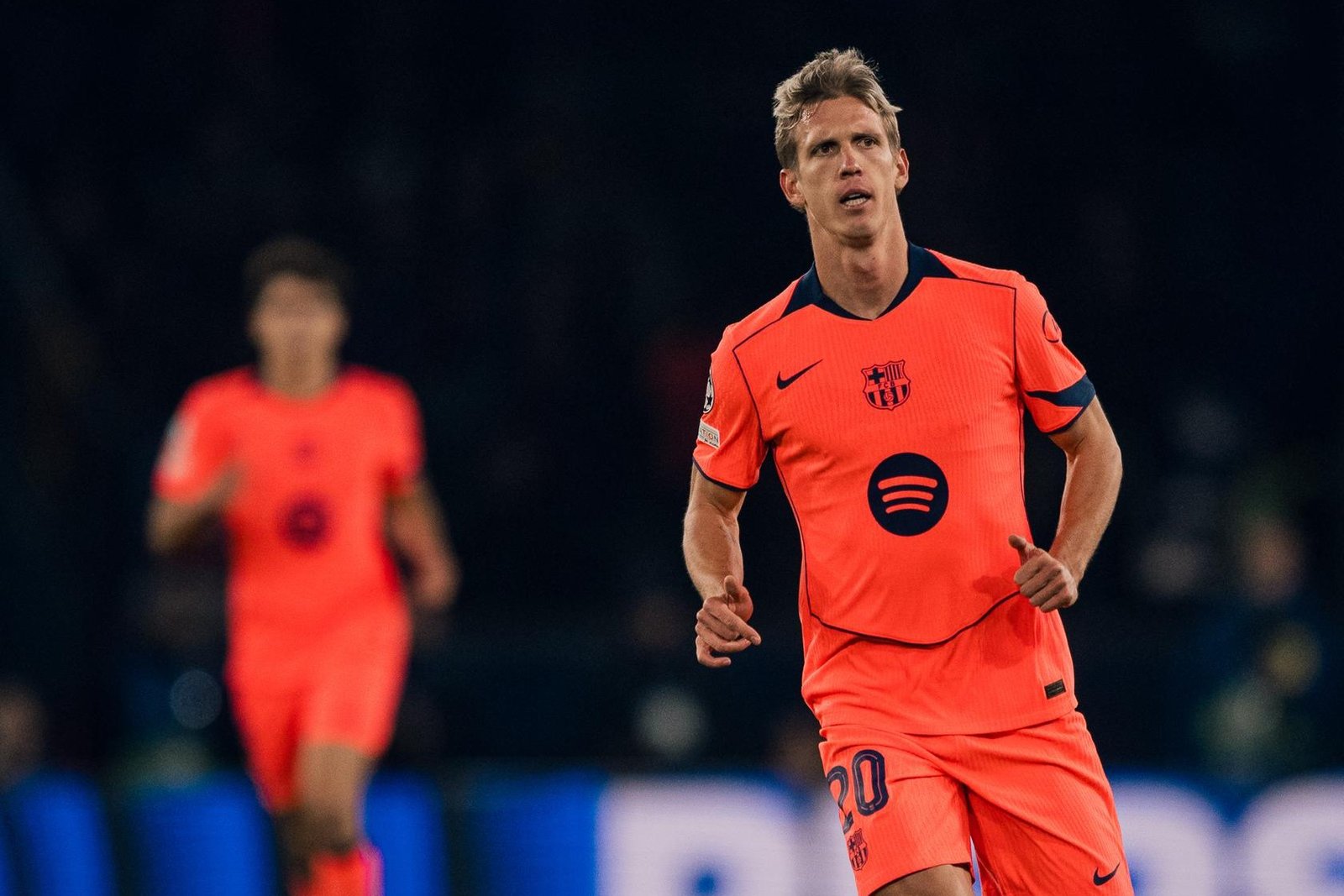 Dani Olmo in Barcelona’s coral away strip during the Champions League match in Paris.