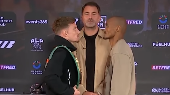 Dalton Smith and Alberto Puello face each other as Eddie Hearn stands behind them.