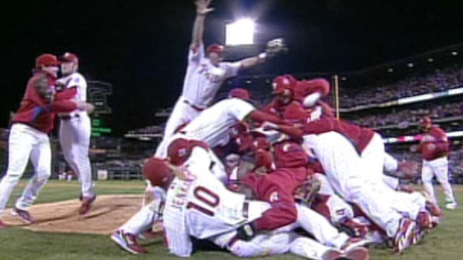 Phillies players pile together on the field after winning the 2008 World Series.