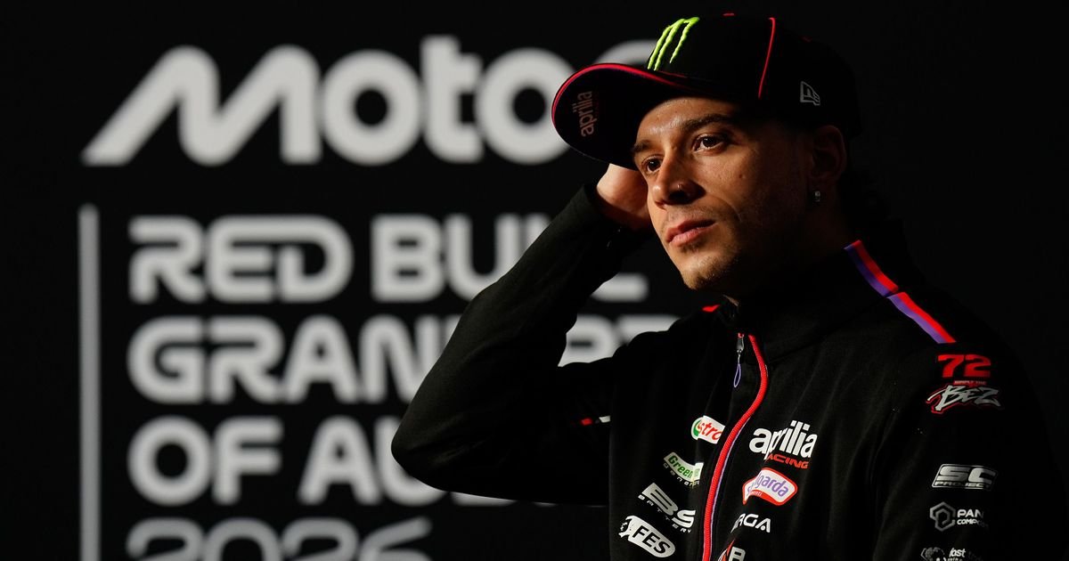 An Aprilia rider in team clothing at the Australian Grand Prix media session.