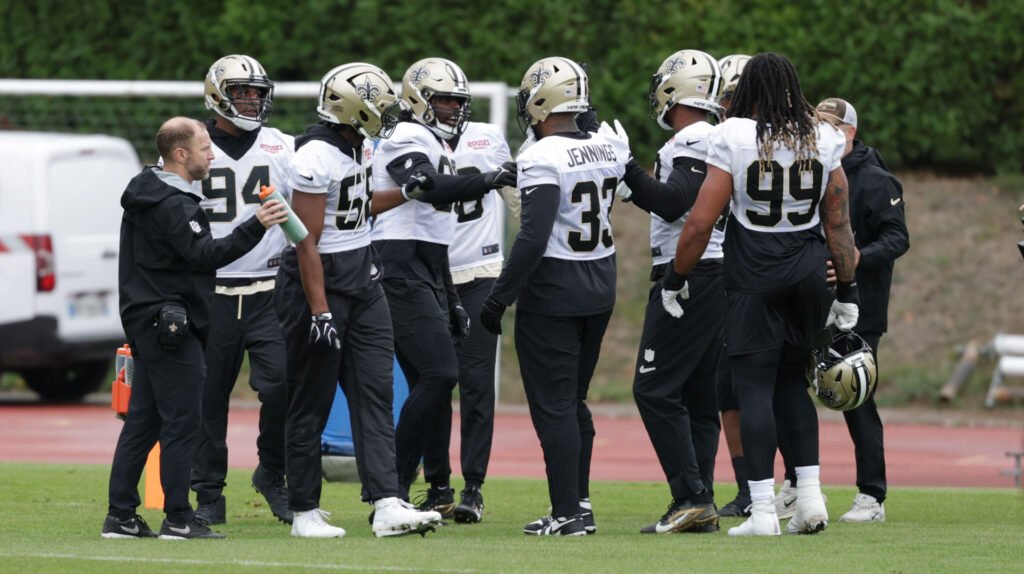Saints players gather during practice in France ahead of the Paris game.