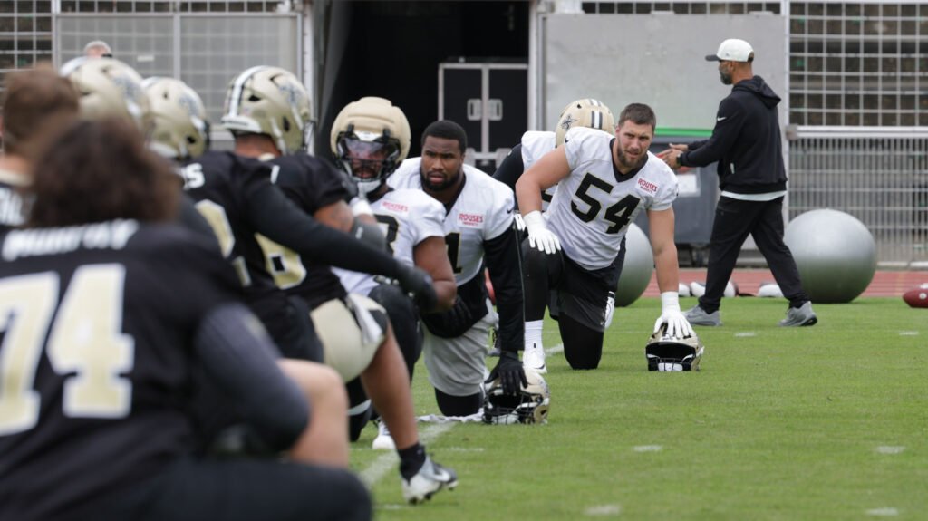 Saints players stretch during practice in France on October 22, 2026.