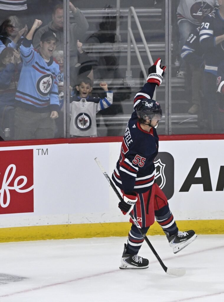 Mark Scheifele raises his arm after scoring against Minnesota on October 13, 2026.