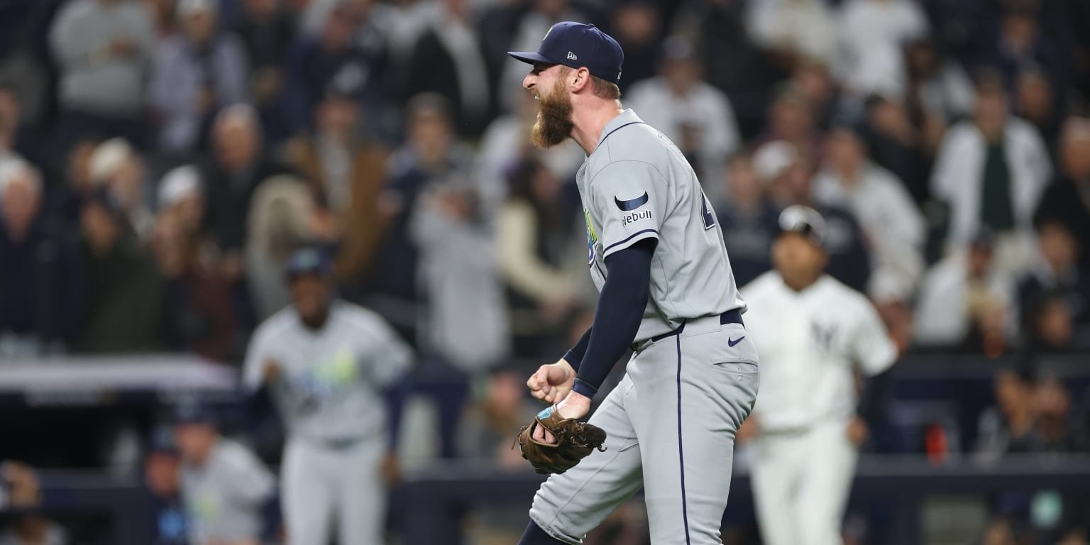 Bryan Baker celebrates in a gray Tampa Bay Rays uniform.