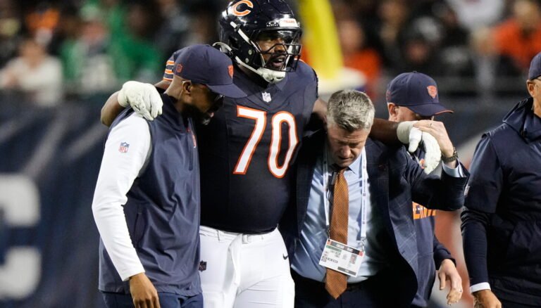 Braxton Jones is helped from the field during Chicago&rsquo;s game against Philadelphia.