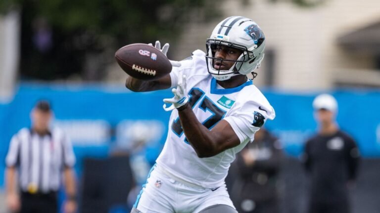 Xavier Legette reaches for a pass in a Panthers practice uniform.