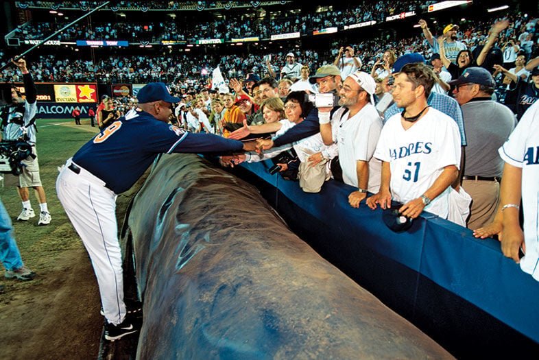 Tony Gwynn reaching toward fans at the ballpark
