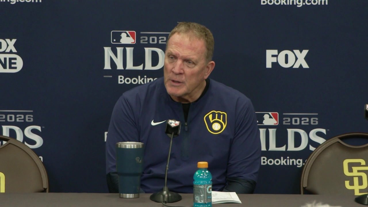 Pat Murphy sits at a microphone in a navy Brewers jacket after NLDS Game 3 at Petco Park.