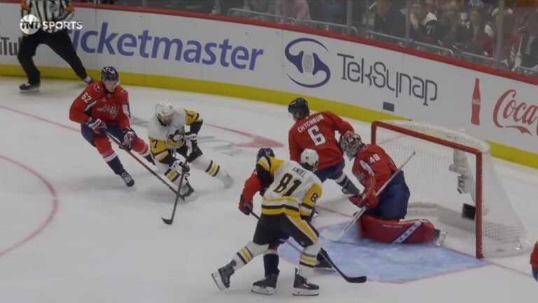 Penguins and Capitals players around Washington’s net during Bryan Rust’s first-period goal on October 7, 2026