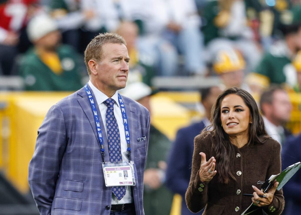 Kirk Herbstreit and Kaylee Hartung stand on the field before Thursday Night Football.