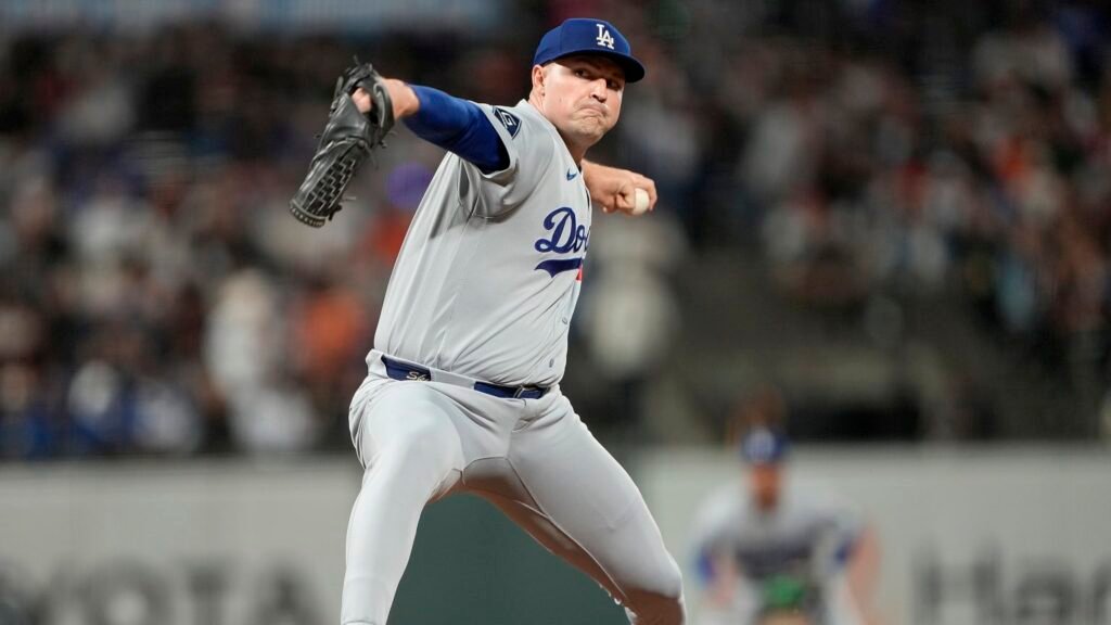 Tarik Skubal delivers a pitch in a gray Los Angeles Dodgers uniform.