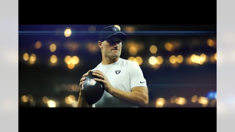 Kirk Cousins holds a football while warming up for the Raiders in New Orleans.