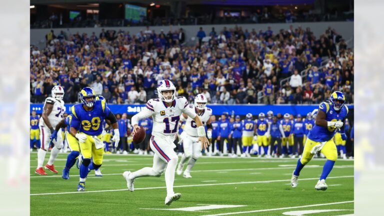 Josh Allen runs with the football as Rams defenders pursue him at SoFi Stadium on October 12, 2026.