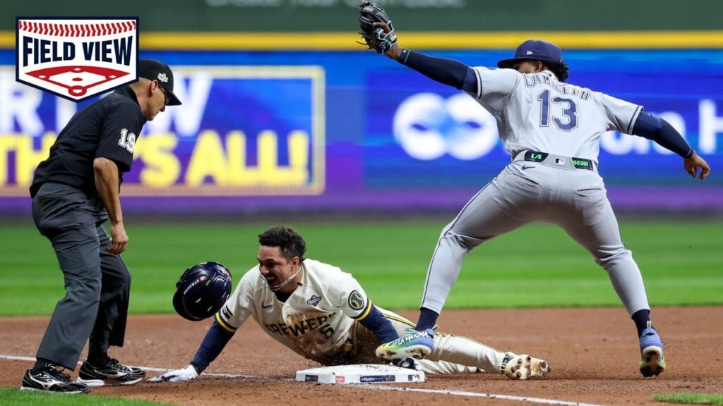 Junior Caminero reaches for a relay as David Hamilton slides into third during World Series Game 1 on October 23, 2026.