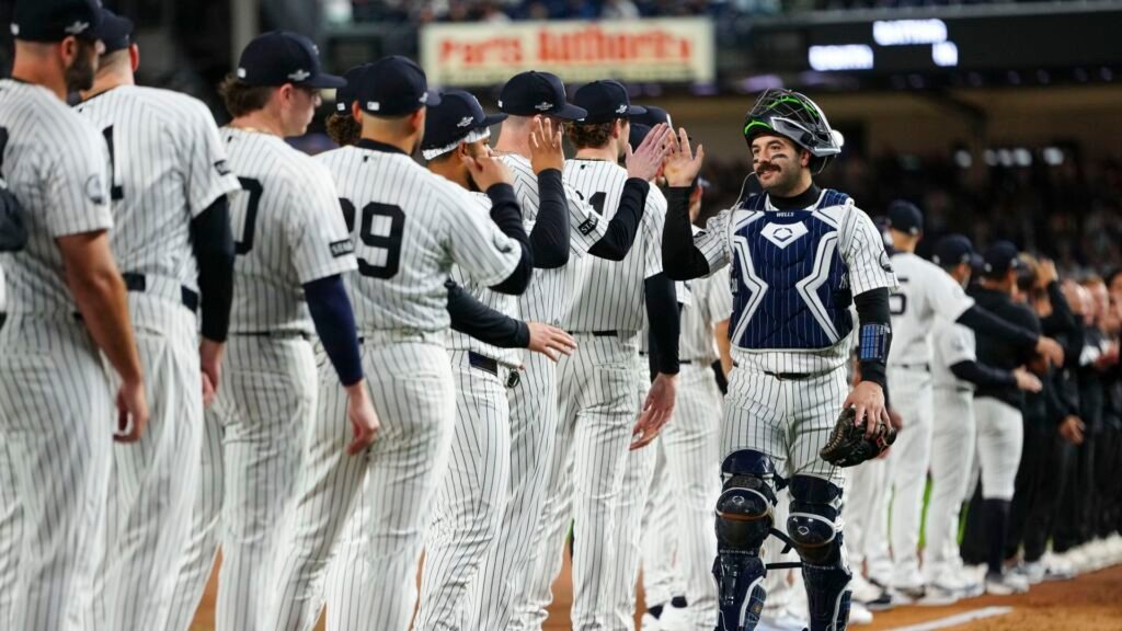 Austin Wells greets his Yankees teammates during introductions before ALDS Game 3 against Tampa Bay at Yankee Stadium on October 7, 2026.