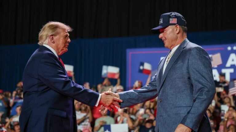 Donald Trump, left, shakes hands with Roger Clemens at the October 7, 2026 rally in San Antonio.