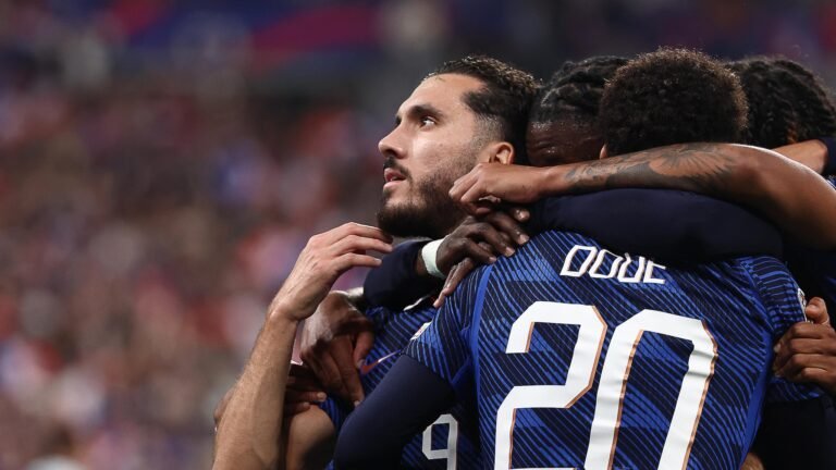 Rayan Cherki celebrates with France teammates, including Désiré Doué.