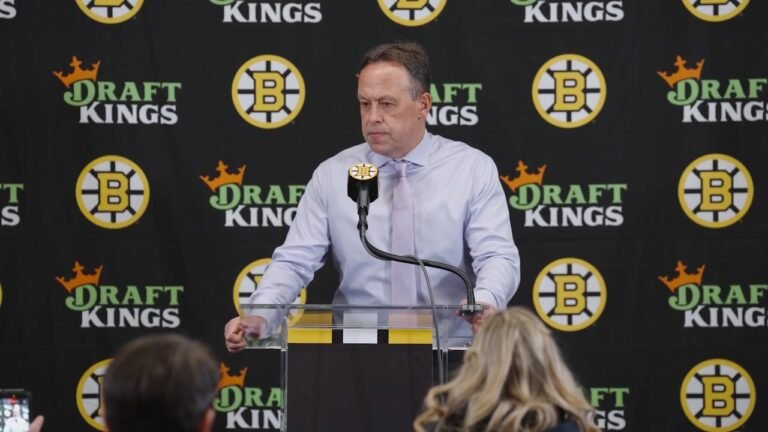 Marco Sturm speaks at a podium in front of a Bruins interview backdrop after the October 5 loss to Ottawa.