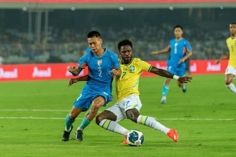 Vinícius Júnior contests the ball with an India defender in Kolkata.