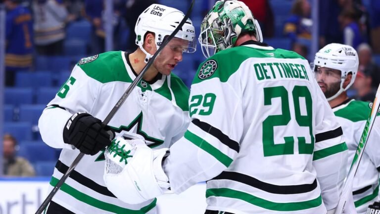 Jake Oettinger with Dallas Stars teammates in white and green uniforms