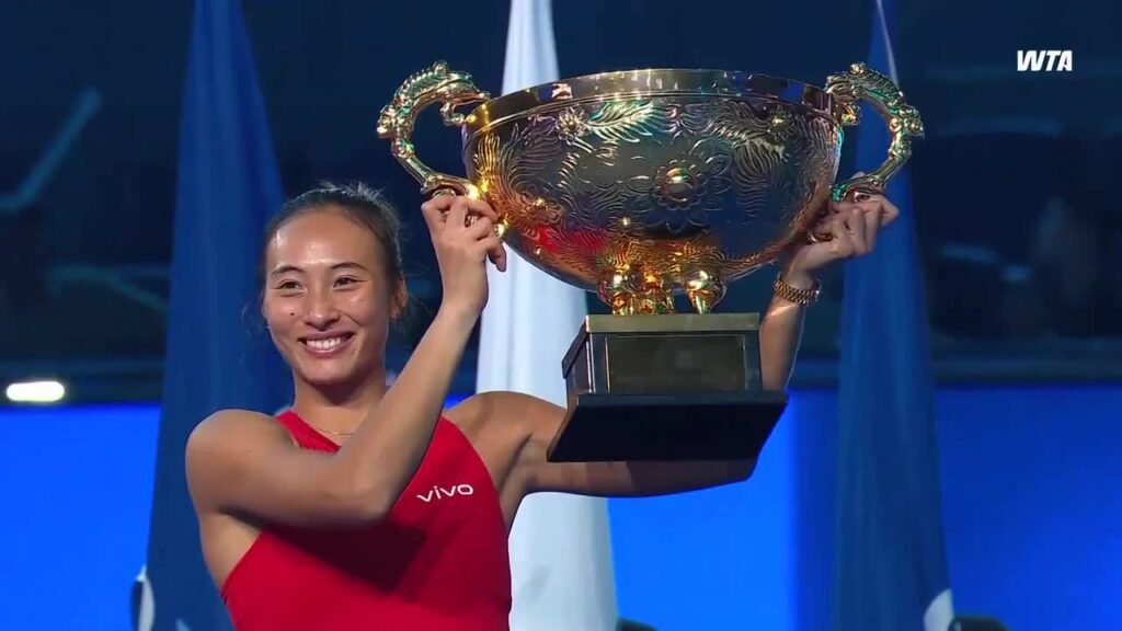 Zheng Qinwen holding the China Open trophy in Beijing.