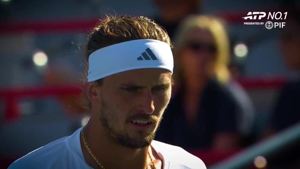 Alexander Zverev wearing a white headband during match footage in the ATP season film.