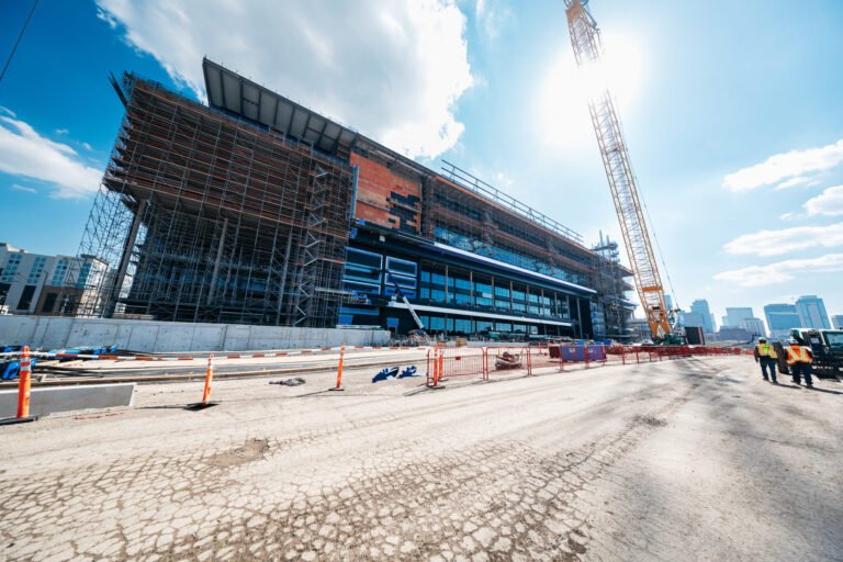 Construction workers and a crane outside the new Nissan Stadium in Nashville.