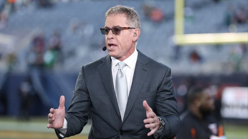 Troy Aikman wearing a headset at Soldier Field before the Eagles–Bears game on September 28, 2026.
