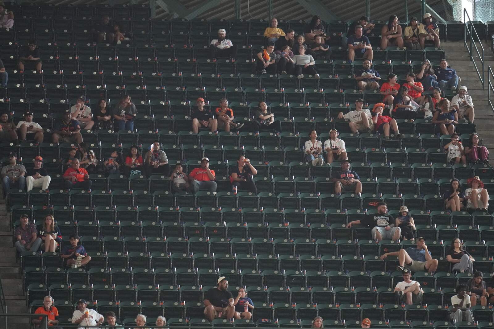 Fans sit among empty seats during the White Sox–Astros Wild Card opener in Houston on September 29, 2026.