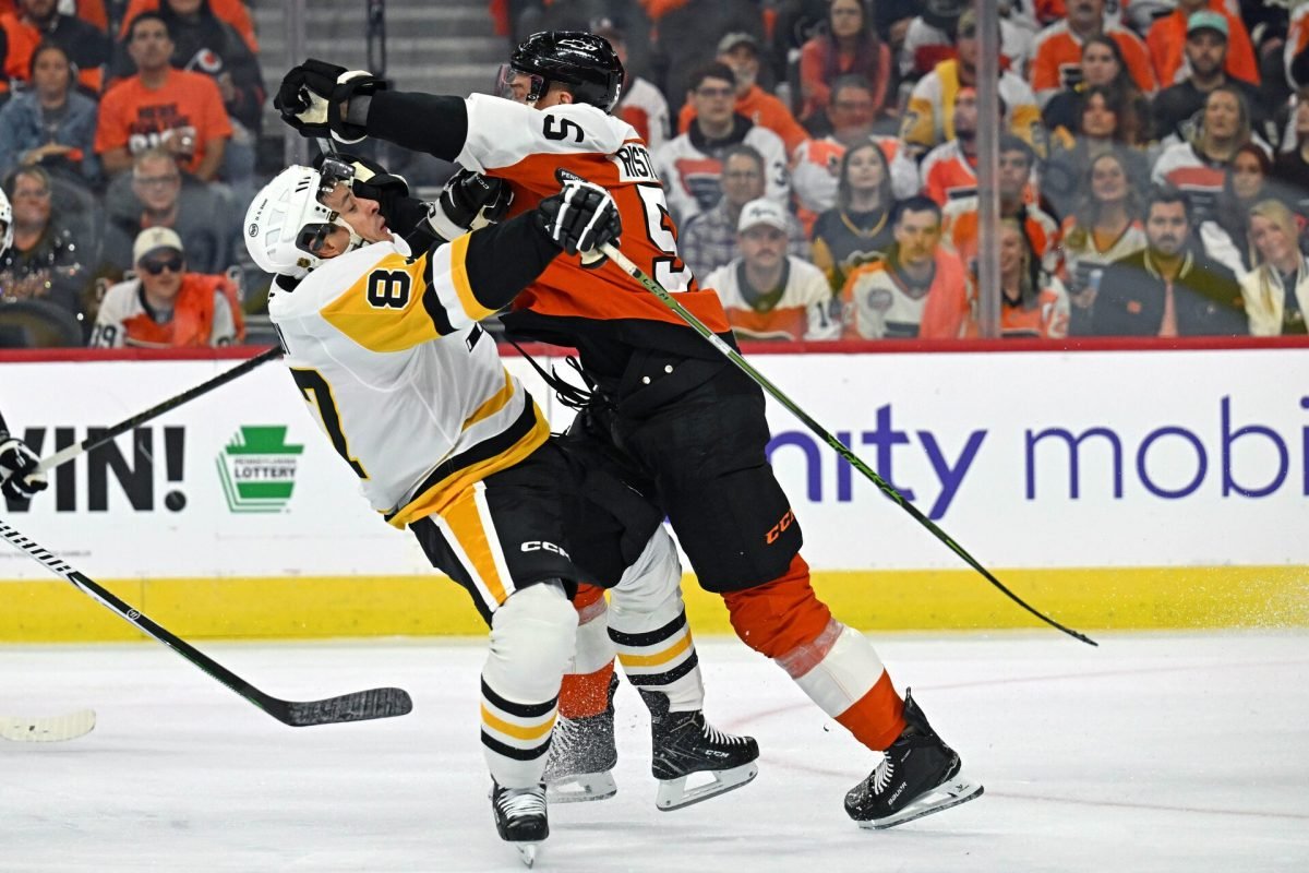 Rasmus Ristolainen checks Sidney Crosby during the Flyers–Penguins opener in Philadelphia on September 30, 2026.