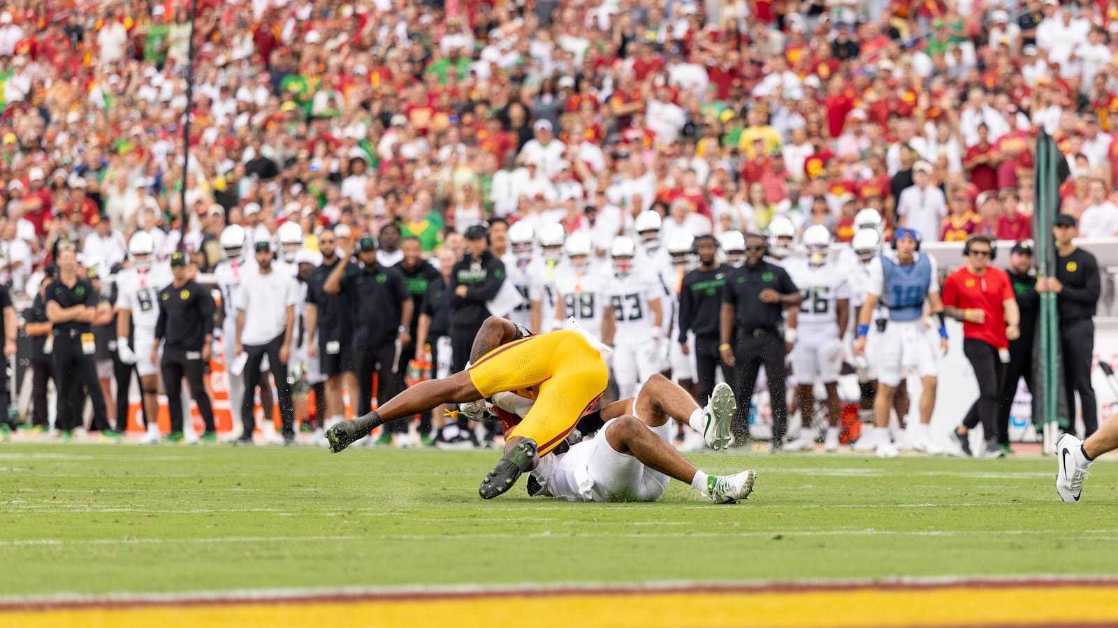 Desman Stephens II makes contact with Oregon quarterback Dante Moore during the September 26, 2026 game in Los Angeles.