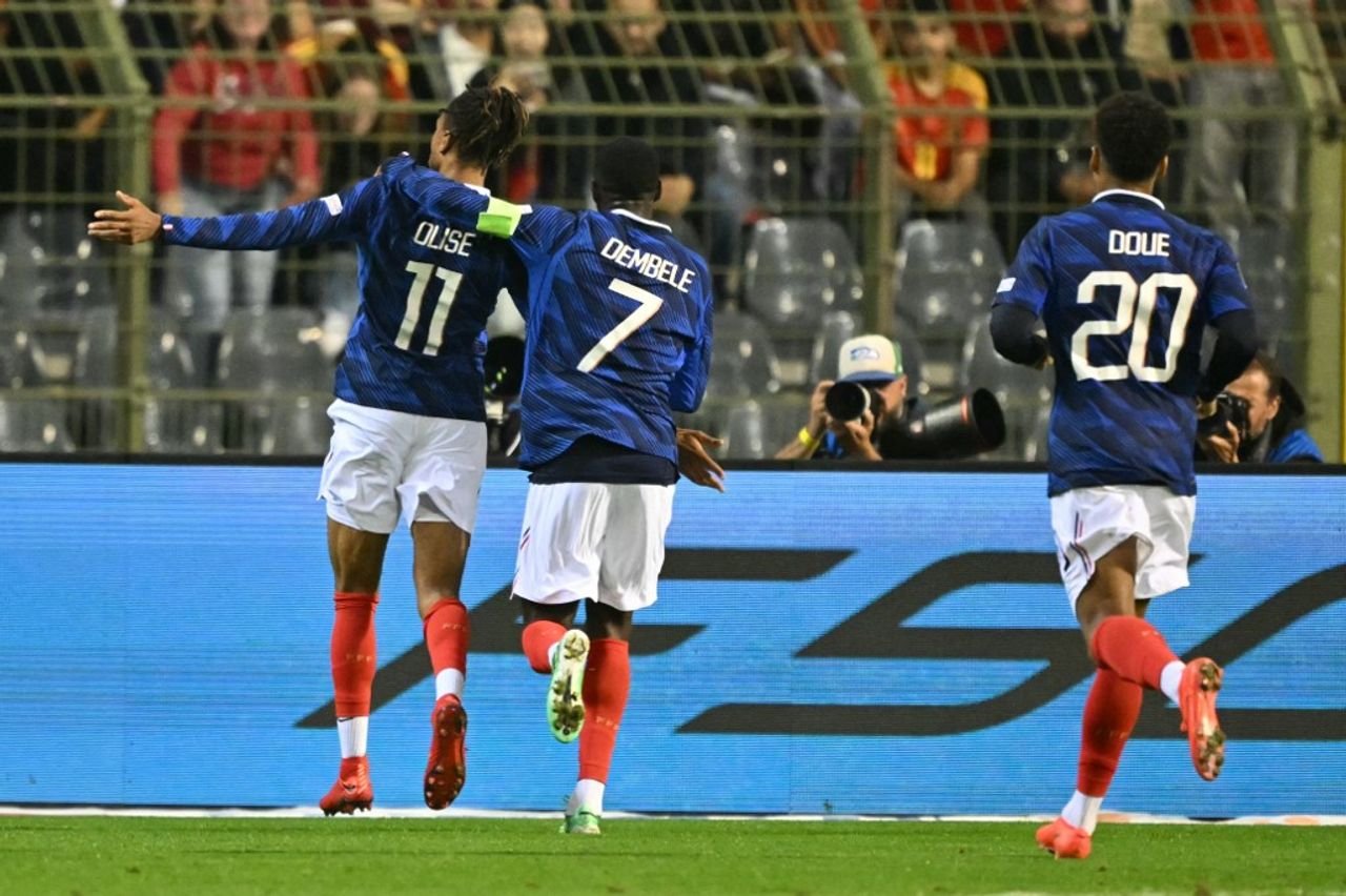 Michael Olise celebrates with Ousmane Dembele after scoring against Belgium in Brussels on September 28, 2026.