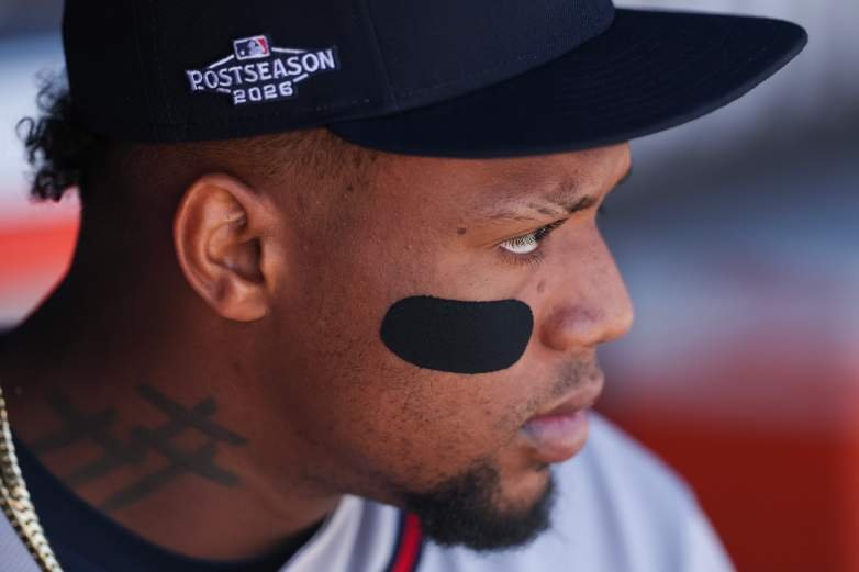 Ronald Acuña Jr. in a Braves postseason cap, shown in profile before NLDS Game 1.